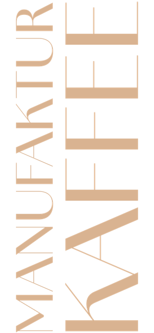 Das Design zeigt den Schriftzug 'MANUFAKTUR KAFFEE' in eleganten, vertikalen Buchstaben auf transparenten Hintergrund.